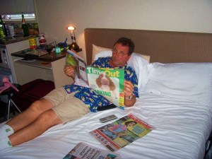 Joe reading in our room on the 16th floor of Hotel Formule1.